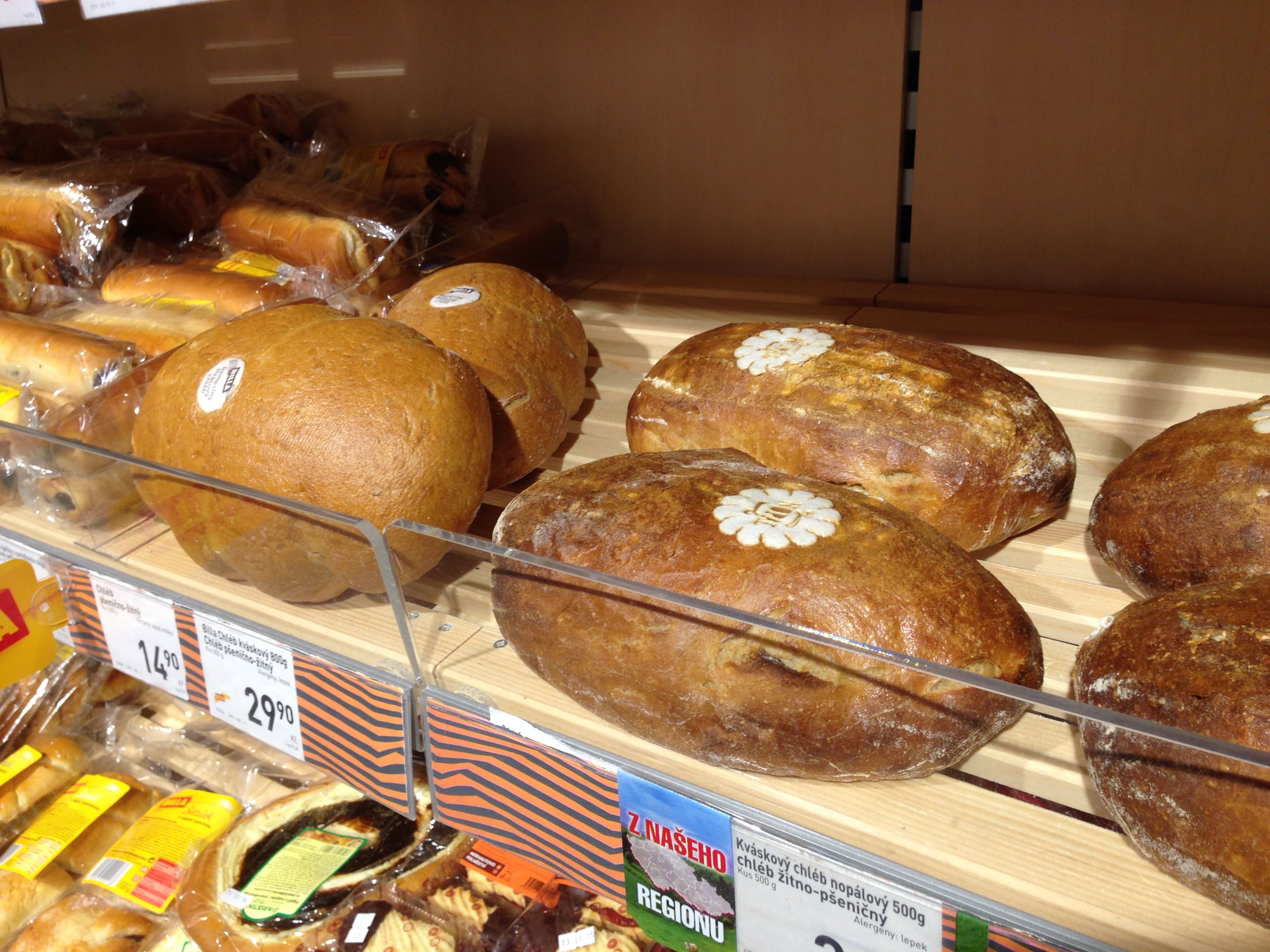 Shelf with loaves of bread marked with an edible label